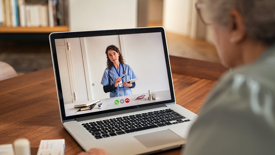 A person speaking with a healthcare professional by video